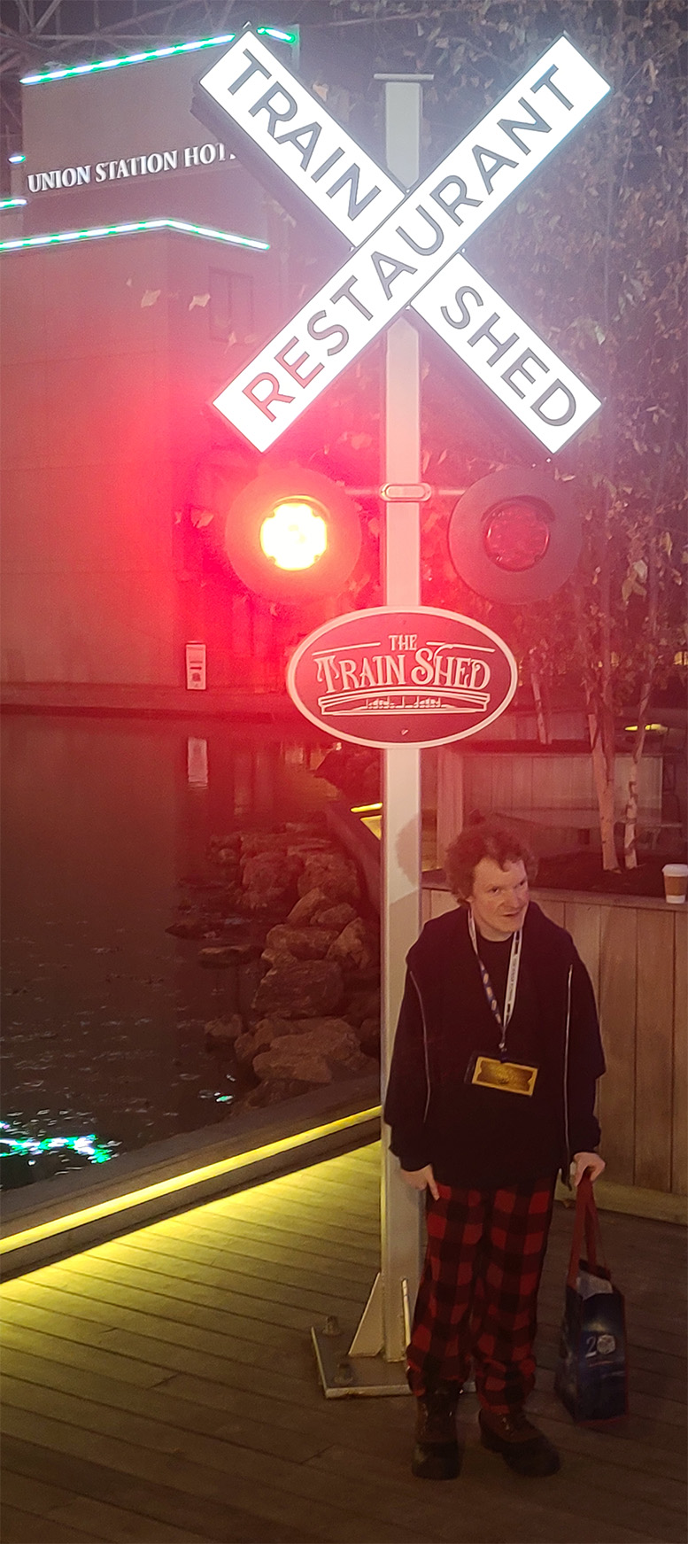 Marky under a railroad crossing sign at Union Station in St Louis MO December 16, 2024